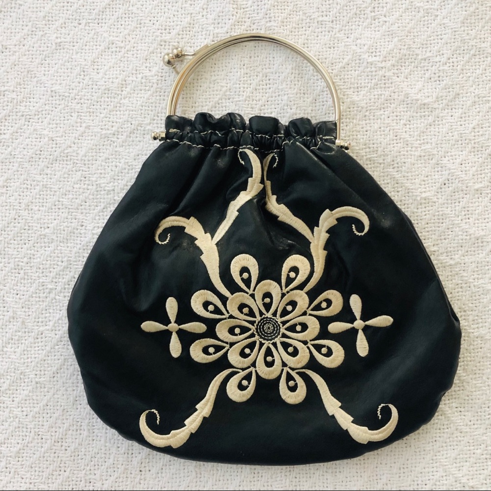Reserved bag. Black with white embroidery.